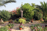Fototapeta  - Saint Francis of Assisi statue in the Garden of Church over the House of Peter in Capernaum at the Sea of Galilee, Israel