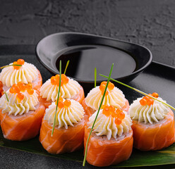 Wall Mural - sushi rolls wrapped with salmon and caviar