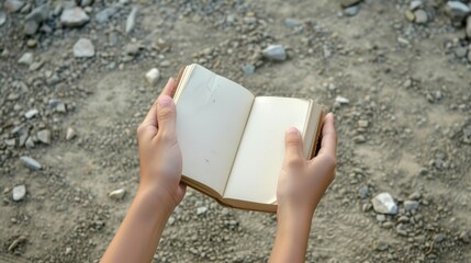 Wall Mural - Close-up of hands holding a journal, symbolizing reflection and personal growth