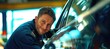 © Wendy2001 - Cheerful handosme caucasian mechanic technician in car service garage workshop taking care of a car with love in auto repair shop smiling at camera