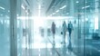 © Eman Suardi - Businesspeople walking at modern office. Concept work process. Business workplace with people in walking in blurred motion in modern office space.
