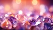 Purple diamonds scattered on the table with a blurred background