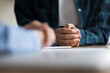 © fizkes - Close up of hands of two young women talking at table. Female patient, customer folding palms over desk, expressing listening attention, consulting advisor, expert, psychologist, counselor