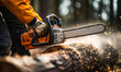 Skilled lumberjack using a chainsaw to cut a log, sawdust flying around as the powerful tool slices through the wood in a forested area