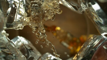 Wall Mural - Super Slow Motion of Pouring Whiskey into Glass. Unique Perspective Composition from Bottom of the Glass. Filmed on High Speed Cinema Camera, 1000 fps.