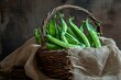 Arranged tableau of snap peas, artistically presented in a rustic basket with a backdrop of textured burlap. The play of light and shadows accentuates the curves and details of the pods.