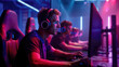 © Александр Марченко - Intense gamer wearing headphones competes in an illuminated esports tournament environment.