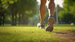 Close-up of man's legs walk in the nature park. Workout in the morning outdoors
