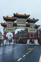 Chinese Wooden Gate In Chinatown Neighbourhood On Rainy Day With Traditional Elements 
