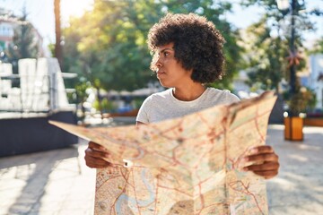 Poster - African american woman holding city map at park