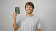 Jovial young man, with twinkling eyes, flaunts his taiwanese passport. standing solo against a white background, his smiling visage radiates confidence and pride.