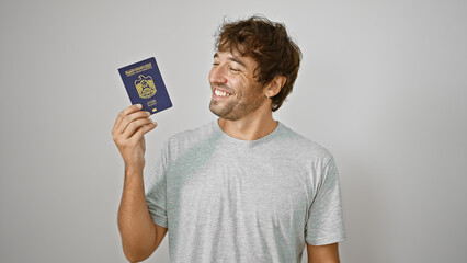 Poster - Joyful young blond adult flashes a confident smile, proudly holding his united arab emirates passport aloof, exuding happiness and patriotism, isolated on a simple white wall background