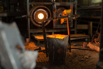 Wall Mural - Foundry ladle with molten metal in workshop of metallurgical plant