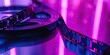 Film reels on a glossy surface with a neon pink light, perfect for a modern film festival poster, a vibrant background for a cinema tech blog, or a promotional image for a new age cinema experience.