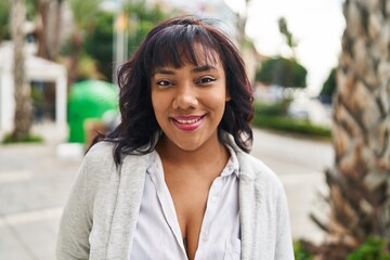 Poster - Young beautiful latin woman smiling confident standing at park