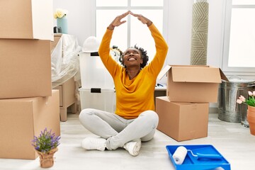 Sticker - African american woman smiling confident doing house gesture with arms at new home