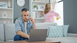 © Krakenimages.com - Man and woman couple doing chores while work at home