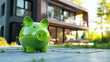 Green piggy bank against the backdrop of an expensive villa. Real estate purchase and insurance concept