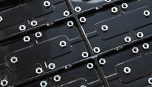 Abstract Background Of Black Corrugated Plastic Panel With Iron Hex Huts  
