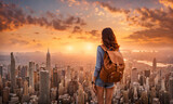 Fototapeta Tulipany - Backpack-clad girl gazing over sprawling cityscape from high vantage point