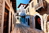 Fototapeta Fototapeta uliczki - Ancient eastern narrow streets of the beautiful Kukort Muslim city on the shores of the Mediterranean Sea, tourist attractions in Turkey,