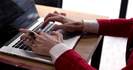 Poster - close up shot of an young business woman's hands busy working on laptop or computer keyboard.