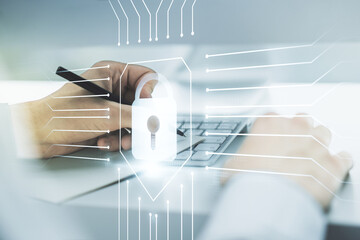 Poster - Double exposure of creative lock hologram with chip and hand writing in notebook on background with laptop. Information security concept
