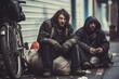 © kozirsky - Two homeless men sitting in dirty city street