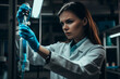 young handsome serious woman sciencist holding a probe with blue liquid looking at it in the lab