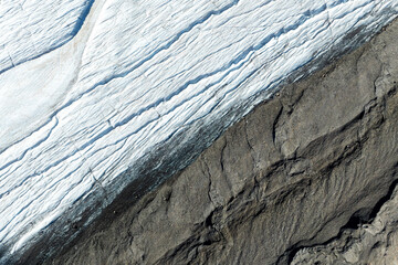 Wall Mural - view of the moraines. glacier and rocks. landscape from the air. river on a moraine. landscape from 