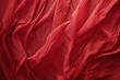 A close up view of a red cloth. Can be used as a background or texture for various design projects