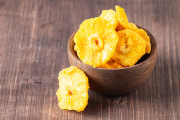 Wall Mural - Dried pineapple in a bowl. Dried fruits. 