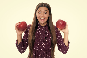 Poster - Portrait of confident teen girl with apple going to have healthy snack. Health, nutrition, dieting and kids vitamins. Emotional amazed excited teen girl.