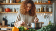 © Studio Nova - A woman is cooking in her kitchen, tasting from a pot with fresh vegetables visible on the counter, radiating a sense of warmth and domestic bliss.