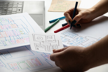 Development and sketches on paper of an individual mobile application for the desktop and hands of the designer, graphic design