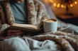 A cozy morning spent with a good book and warm cup of coffee, the perfect combination for a peaceful indoor escape