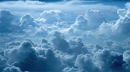 Wall Mural - a group of clouds in the sky with a bright blue sky in the middle of the picture and a few white clo