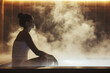 © Formoney - woman sitting in a sauna, with steam rising around her