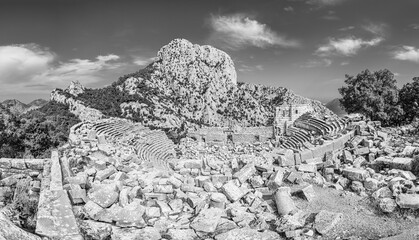 Wall Mural - Termessos Amphitheater ruins on the south west side of the mountain Solymos in the Taurus Mountains Antalya province, Turkey in black and white