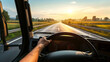 © Studio Nova - first-person view of a driver's hands on a steering wheel