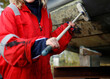 © corlaffra - Close-up of a young woman cleaning her boat in a marina, Holland