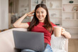 © Prostock-studio - Domestic Leisure. Young Asian Woman Relaxing With Coffee And Laptop At Home