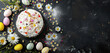 © Klay - easter celebration cake with colorful eggs and chamomile flowers on dark background