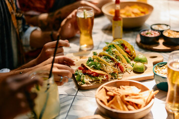 Wall Mural - Close up of people eating in Mexican restaurant.