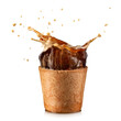 Espresso coffee splash from an edible wafer cup on white background