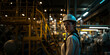 Portrait of female industrial engineer, with white hard hat standing in a heavy industrial factory.