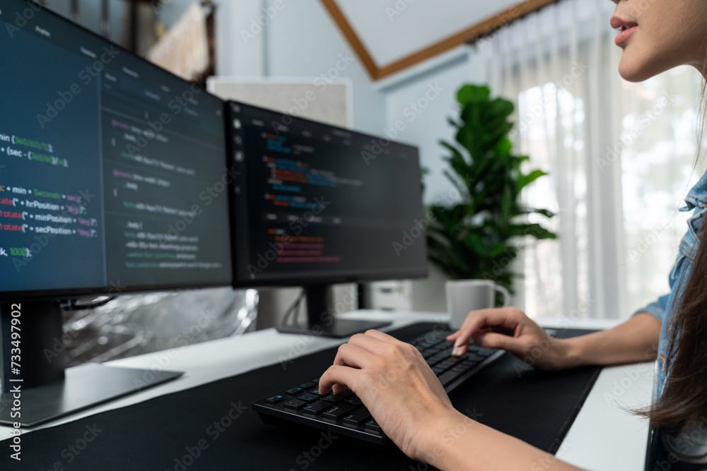 Young Asian in IT developer creating with typing online information on ...
