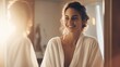 Self-Care Concept. Portrait Of Attractive Young Female Looking At Mirror, Beautiful Woman Wearing White Silk Robe Touching Soft Skin On Face And Smiling, Enjoying Her Reflection, Selective Focus