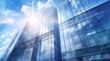 © Riz - Modern office building with glass facade on a clear sky background. Transparent glass wall of office building.