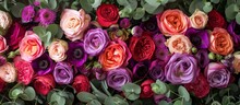 Assorted Vibrant Flowers In Lavender Purple And Red Shades Available At The Florist Shop: Roses, Ranunculus, Tulips, Eucalyptus, Eustoma, Mattiolas, And Carnations.
